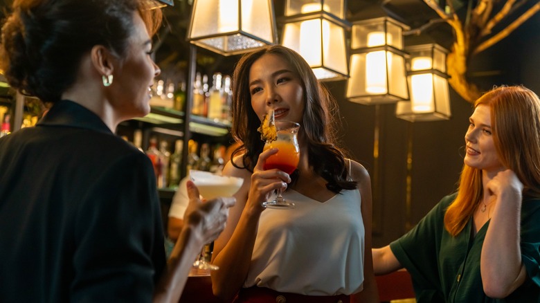Woman talking at bar