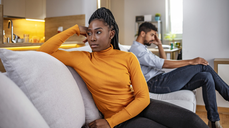 Couple fighting, turned away from each other
