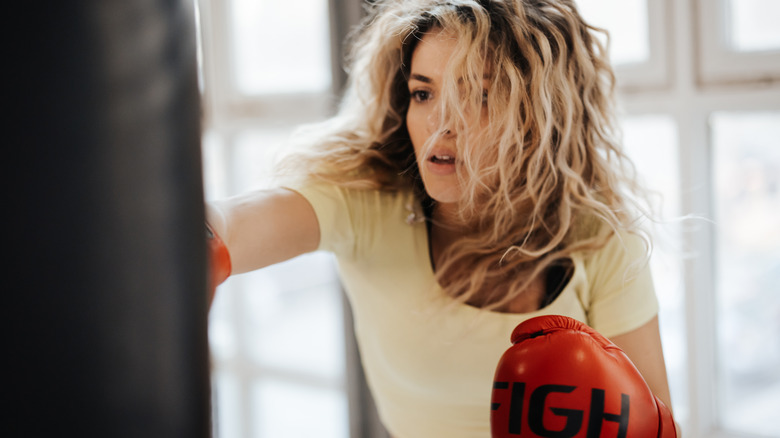 woman boxing at gym