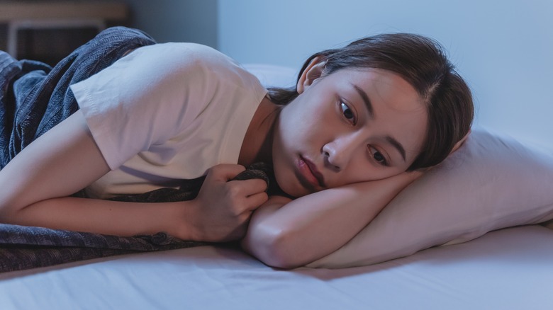 Woman struggling to sleep
