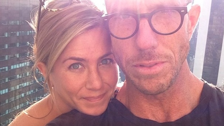 Jennifer Aniston posing with a friend without makeup on