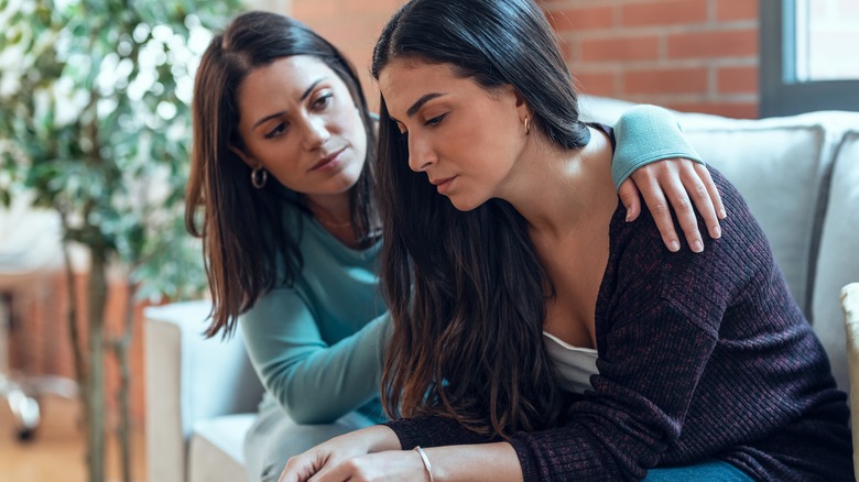 Woman comforting her friend