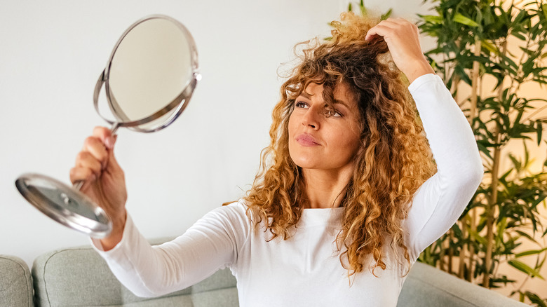 Woman looking in the mirror