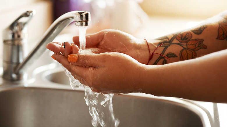 Washing tattooed hands