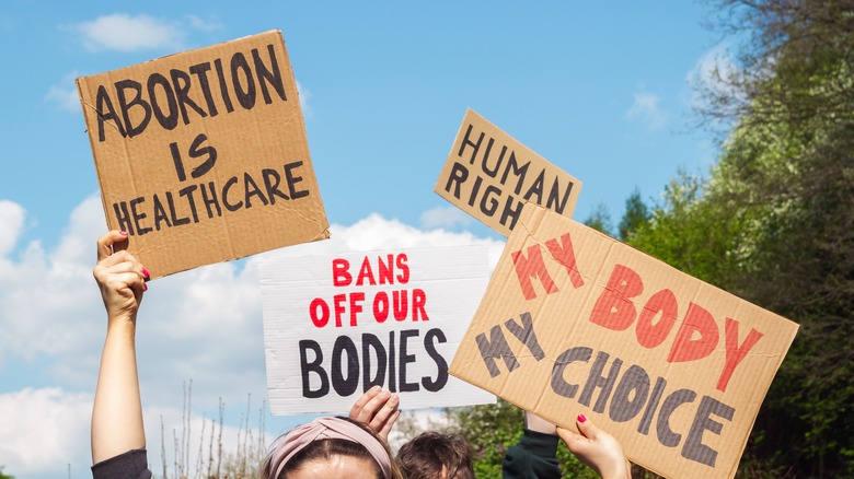 Women with abortion rights signs