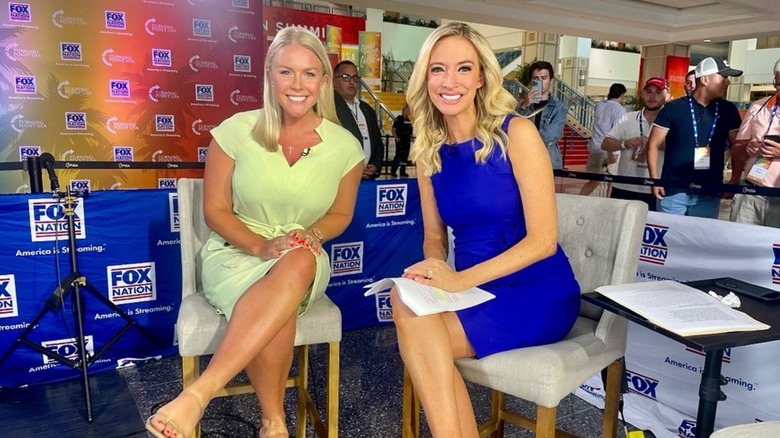 Karoline Leavitt and Kayleigh McEnany posing together in a TV studio