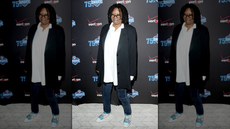 Whoopi Goldberg posing on the red carpet in 2010