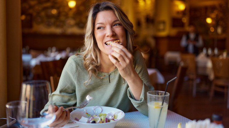 Woman enjoying meal alone