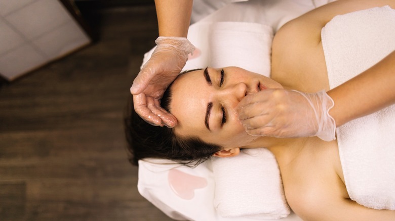 Woman getting a face massage