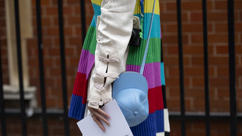 Person wearing colorful knit sweater