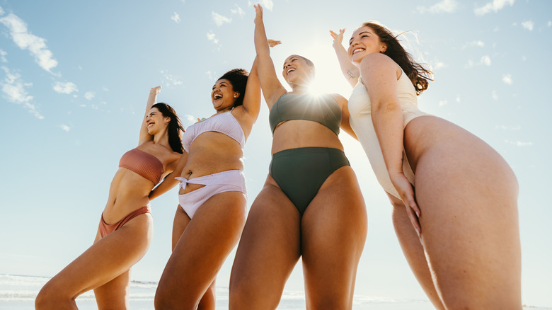 Women in bikinis on the beach