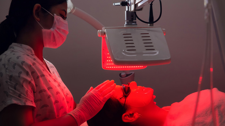 Light therapy by aesthetician