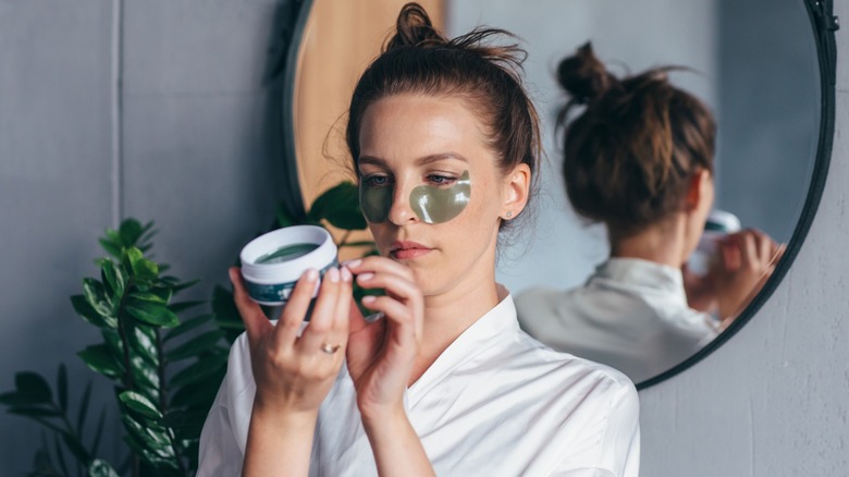 Woman checks label on facemask