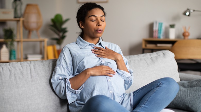 Pregnant woman on couch