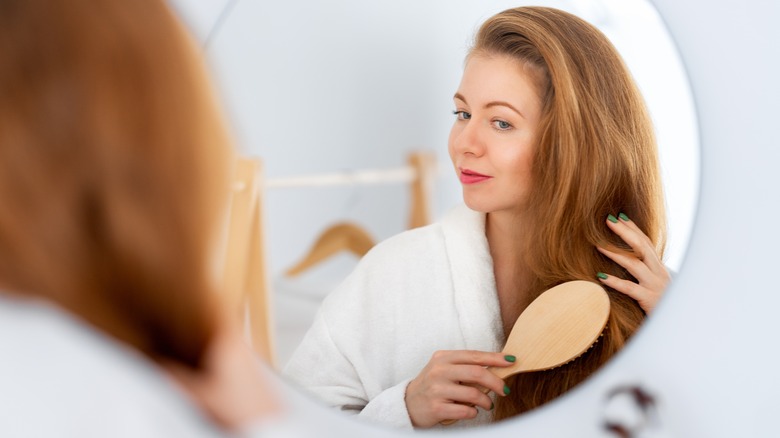 Woman brushing hair