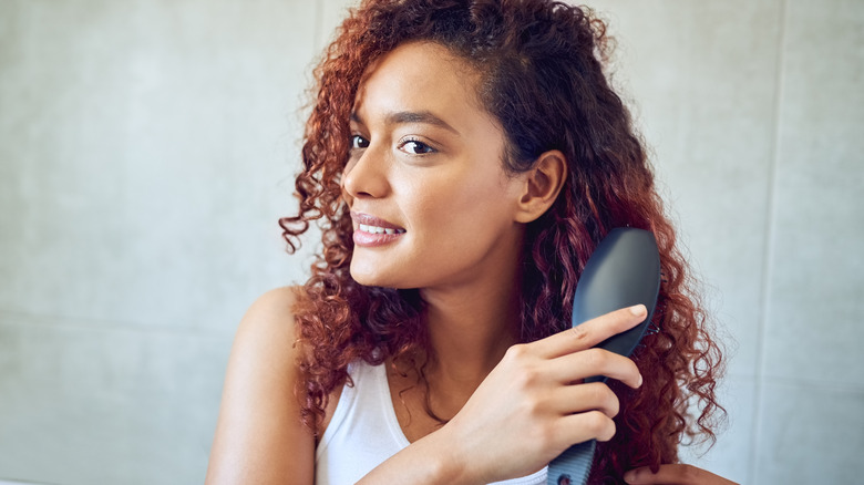 Woman brushing hair