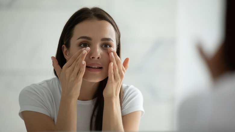 woman applying facial product