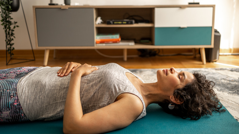 Laying on yoga mat