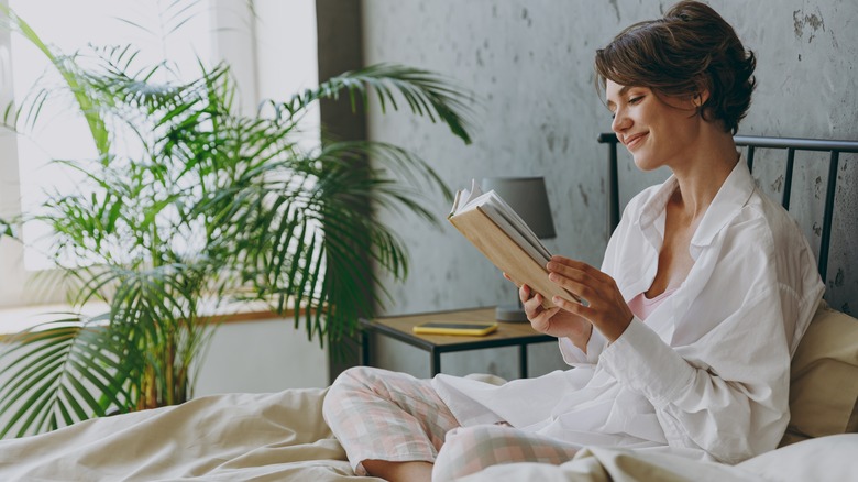 Woman reading in bed