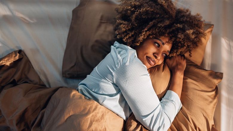 Person lazing around in bed