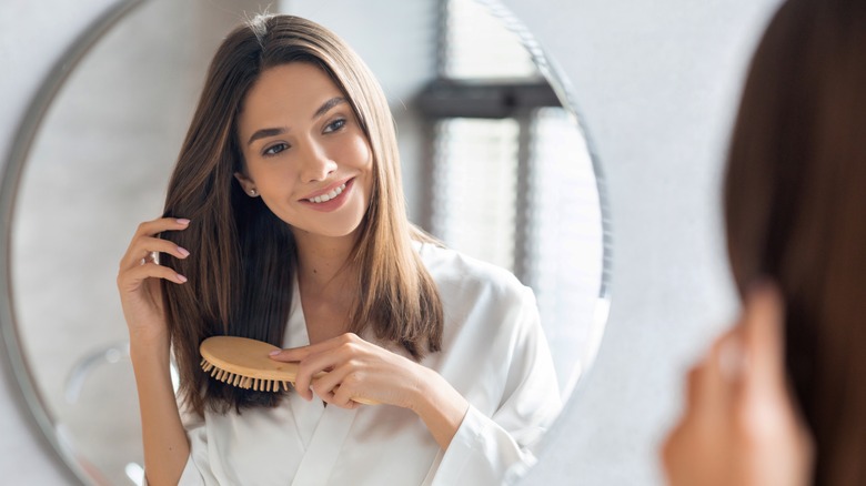 Woman brushing milk tea hair