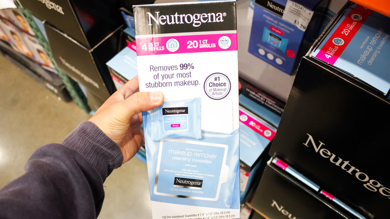 Close-up of hand pulling out makeup wipe