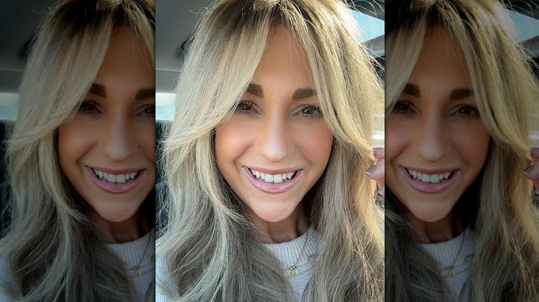 A woman with layered bangs