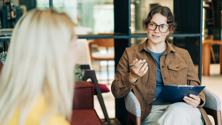 A woman speaking with a female therapist