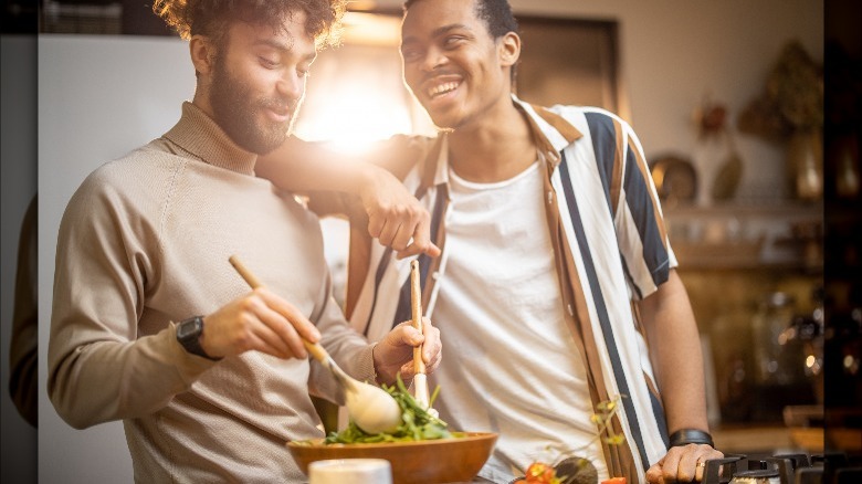 Two men cooking together