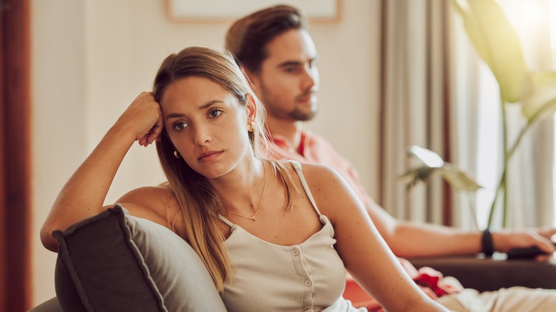 Couple facing away from one another