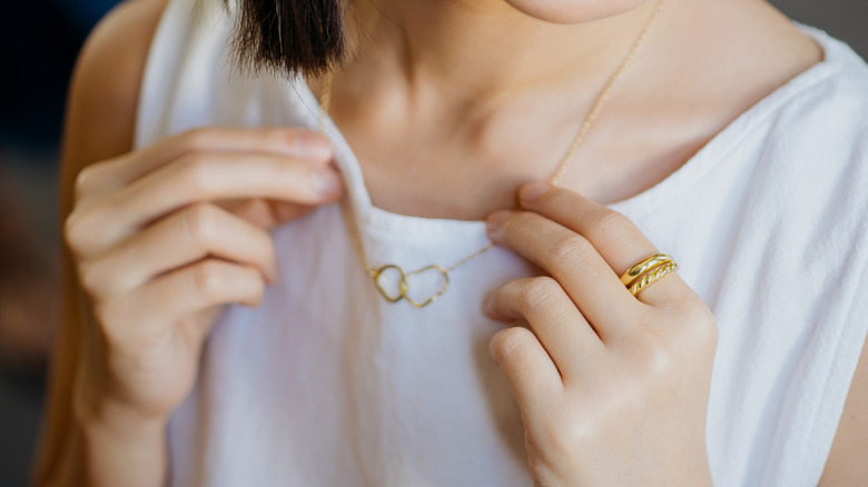 woman wearing gold jewelry