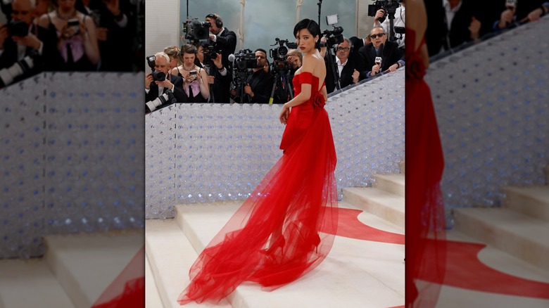 Kelsey Asbille with a dark bob and red dress at the Met Gala