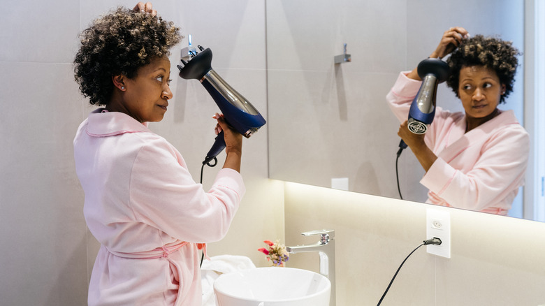Woman drying hair