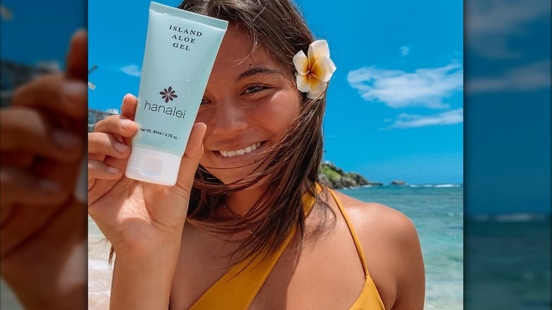 Girl holding Hanalei Aloe Gel 