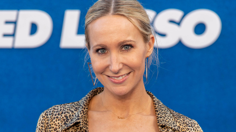 Nikki Glaser with triangle earrings