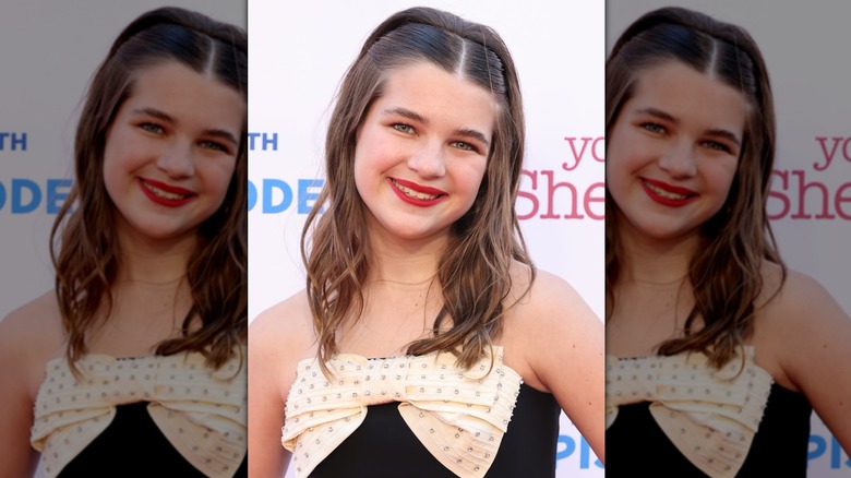 Raegan Revord smiling with a sleek-looking hairstyle at a "Young Sheldon" event