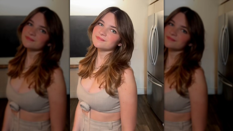 Still of Raegan Revord posing with a layered haircut in a TikTok video