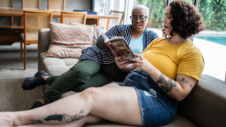 Two women reading on floor