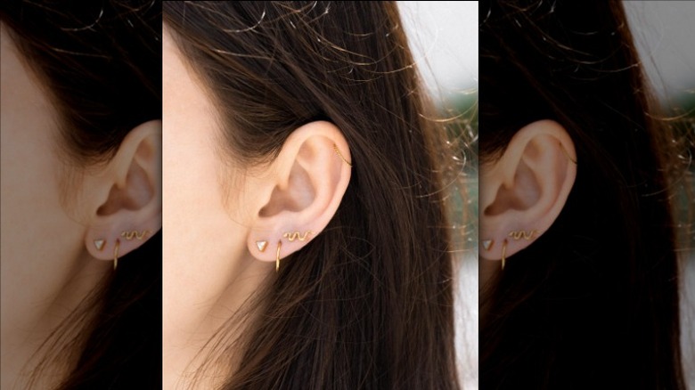 two ear piercings lobe