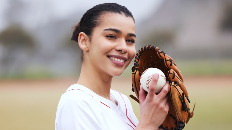 A woman playing baseball