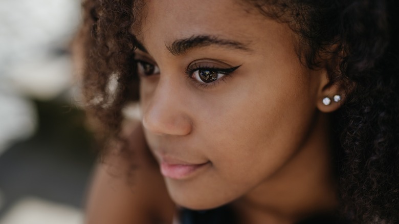 A woman with brown eyes
