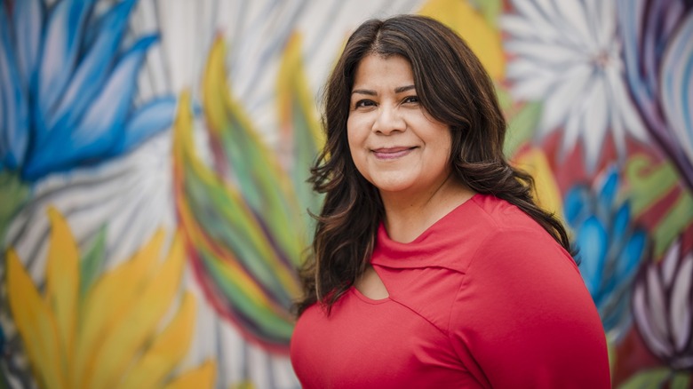 A woman with brown eyes smiling