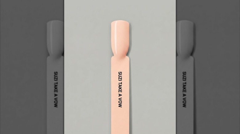 A nail polish shade against a gray background
