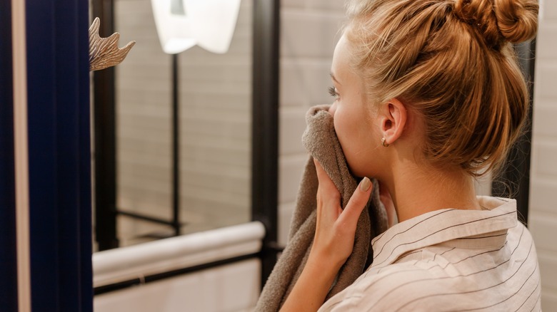 Woman using makeup wipe