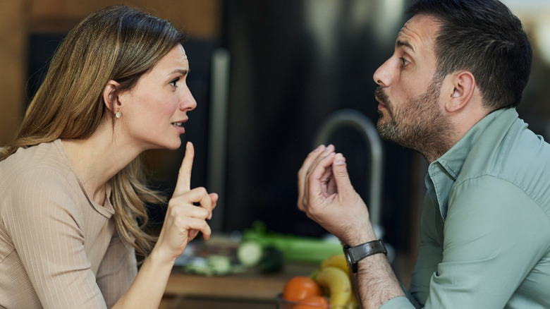 couple arguing in kitchen
