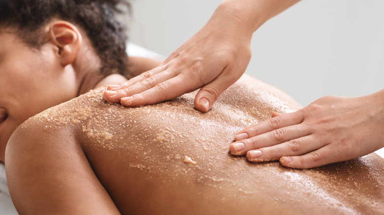 Woman getting scrubbed