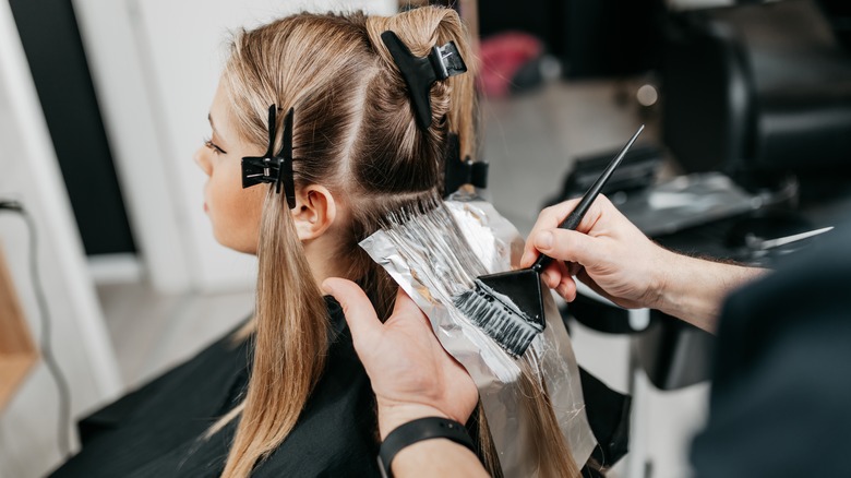 Woman receiving foilyage treatment