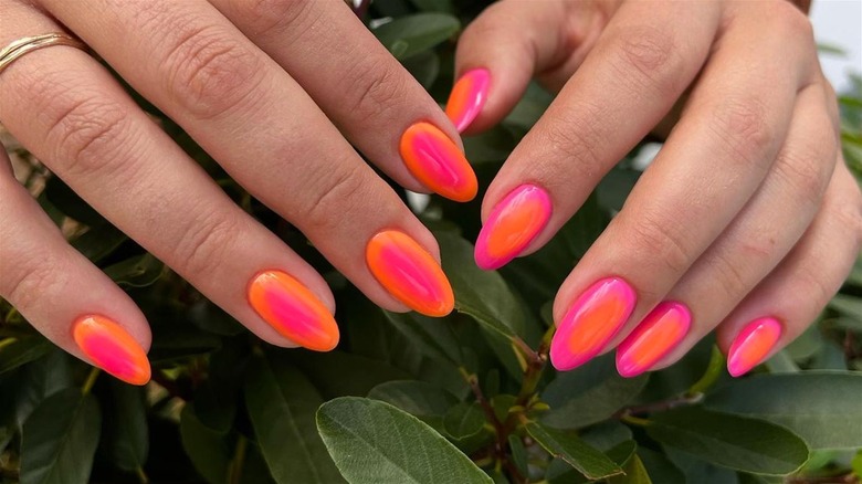 Artistic Self-Care: Young Woman Applying Black Nail Polish with Precision  and Style on Red Background Stock Image - Image of self, woman: 104959367