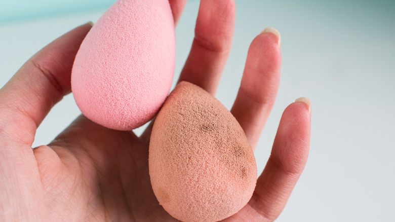 one clean sponge and one dirty sponge