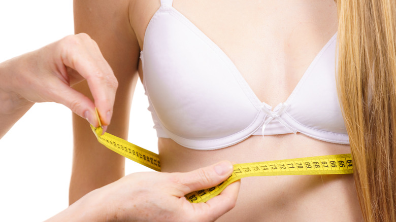 woman being fitted for bra
